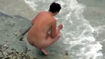 she is peeing in the water near the beach, Piss Voyeur (various), PissRIP